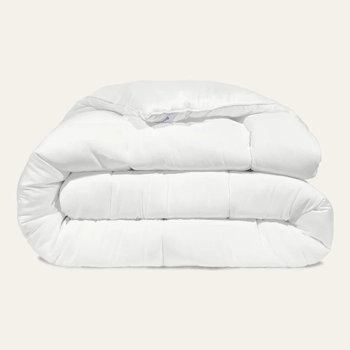White comforter on a light gray background