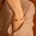 The Bantu solid brass bracelet by Oriaku Studio, featuring clean lines and a satin polish finish handcrafted in Nairobi.