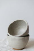 Minimalist handcrafted dessert bowl in premium white stoneware with a smooth matte glaze.