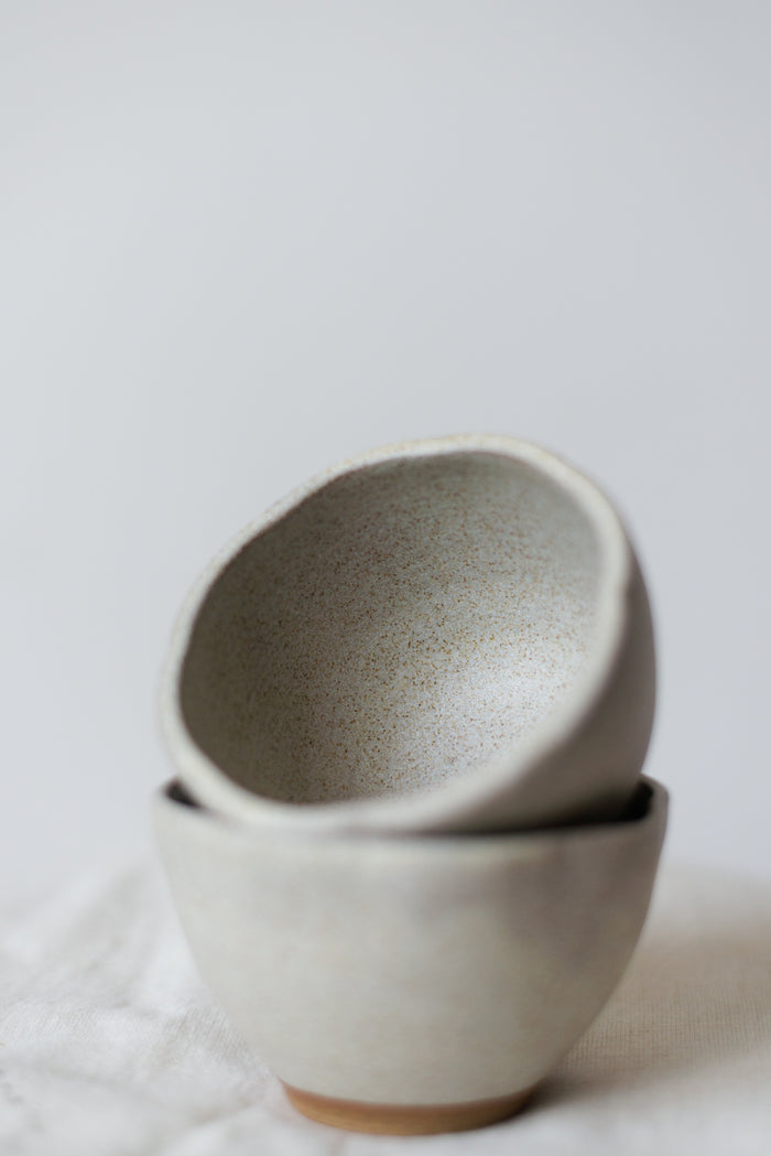 Minimalist handcrafted dessert bowl in premium white stoneware with a smooth matte glaze.