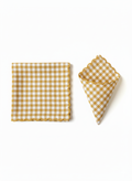 Two yellow checkered napkins on a white background