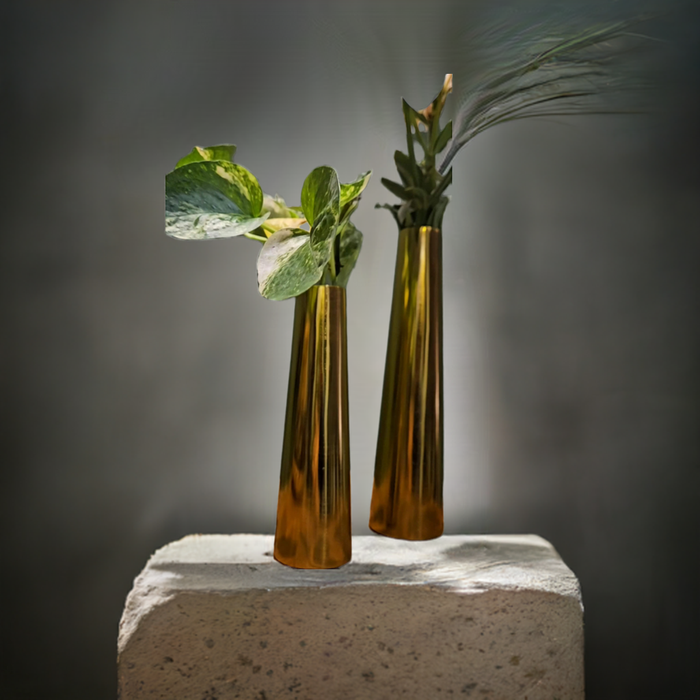 A set of two handcrafted iron vases featuring a sleek, tapered silhouette and a warm metallic gold finish.