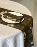 The Khadee Tablecloth, a classic 100% woven linen duk in a neutral natural Khadi tone for 6-seater tables.