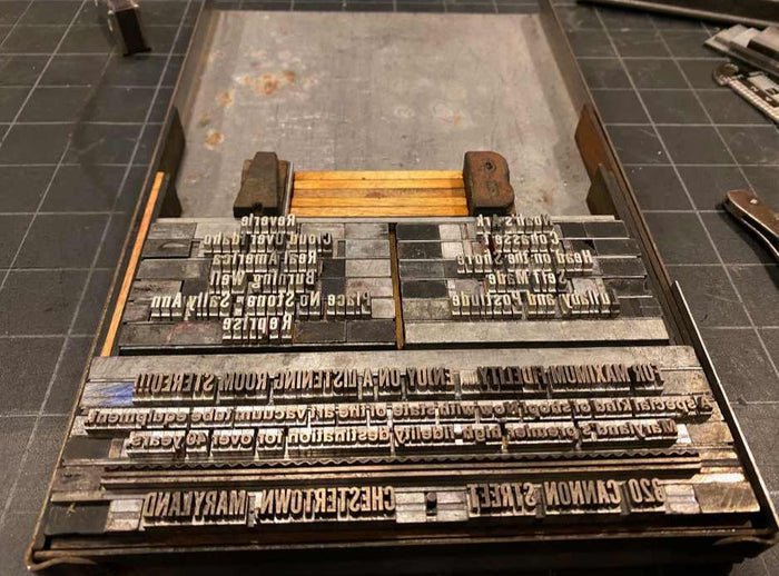 Mike Hoatson printing gift cards on vintage press