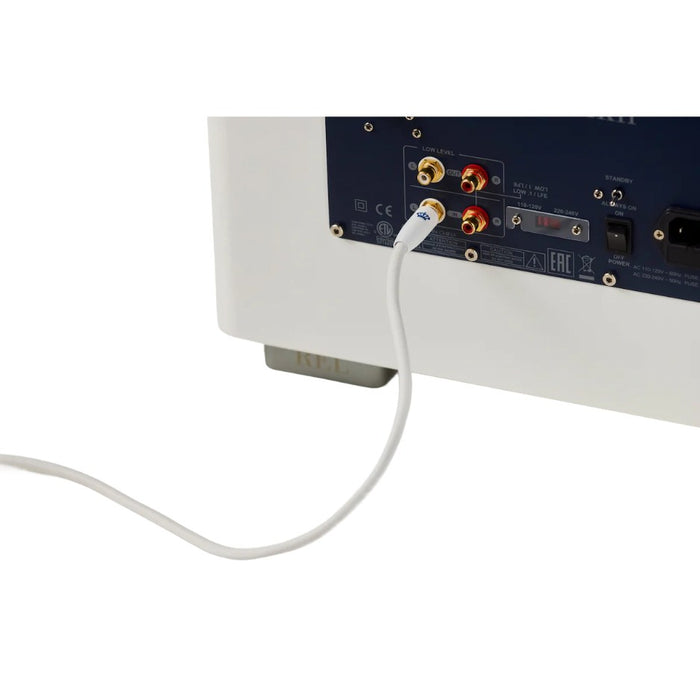 REL Commander™ .1/LFE Subwoofer Cable, White, lifestyle, connected to a white subwoofer rear connection panel