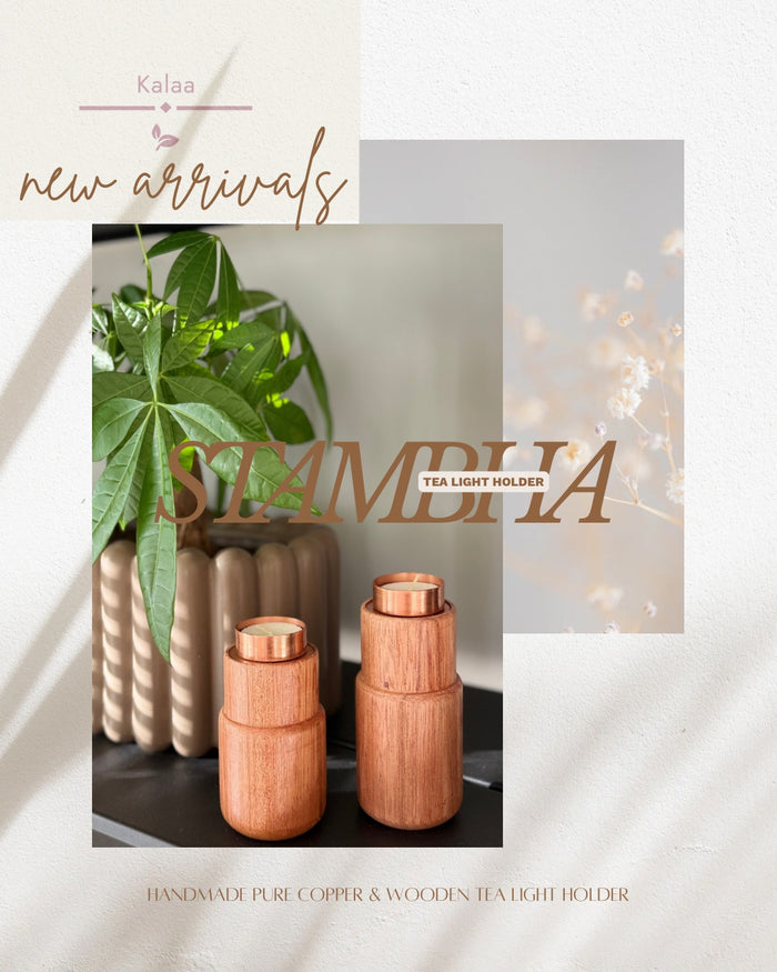 Small and large Stambha holders paired together as a modern centerpiece, casting a warm golden glow on a dinner table.