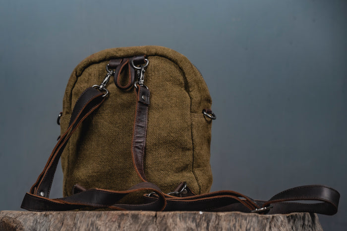 Convertible Lil Sister bag in sustainable jute shown as both a mini backpack and crossbody sling by Kalaa.