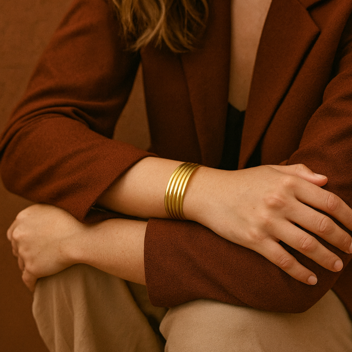 Model wearing the Tolu multi-strand bracelet, showcasing how the four bands flow naturally on the wrist.